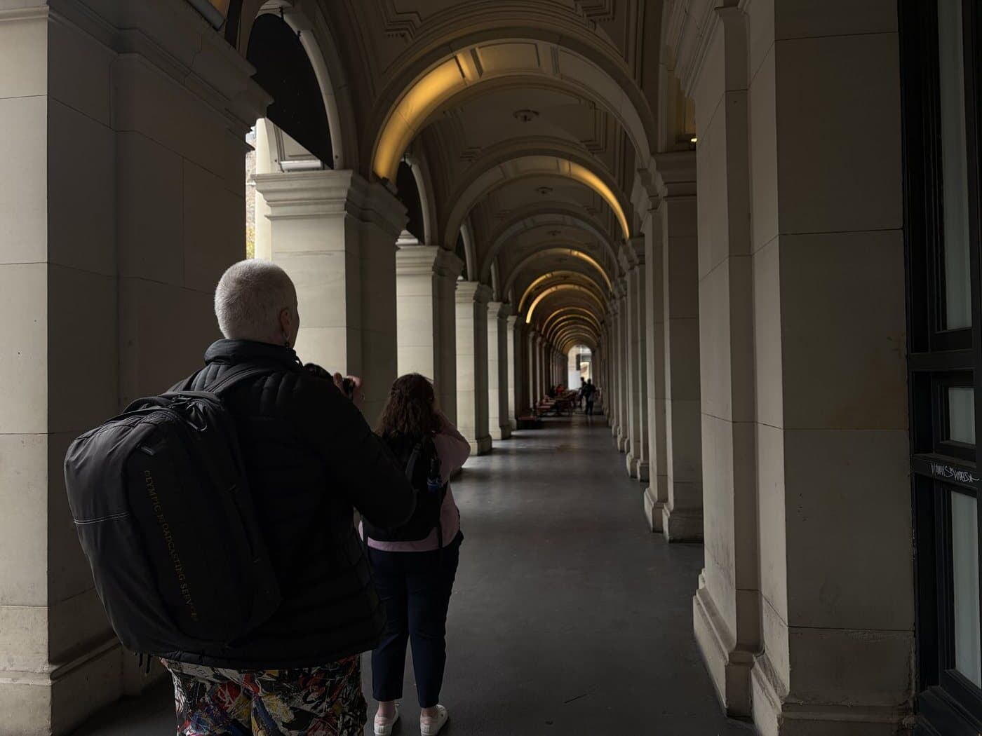 Students photographing grand heritage architecture during a photography course in Melbourne CBD
