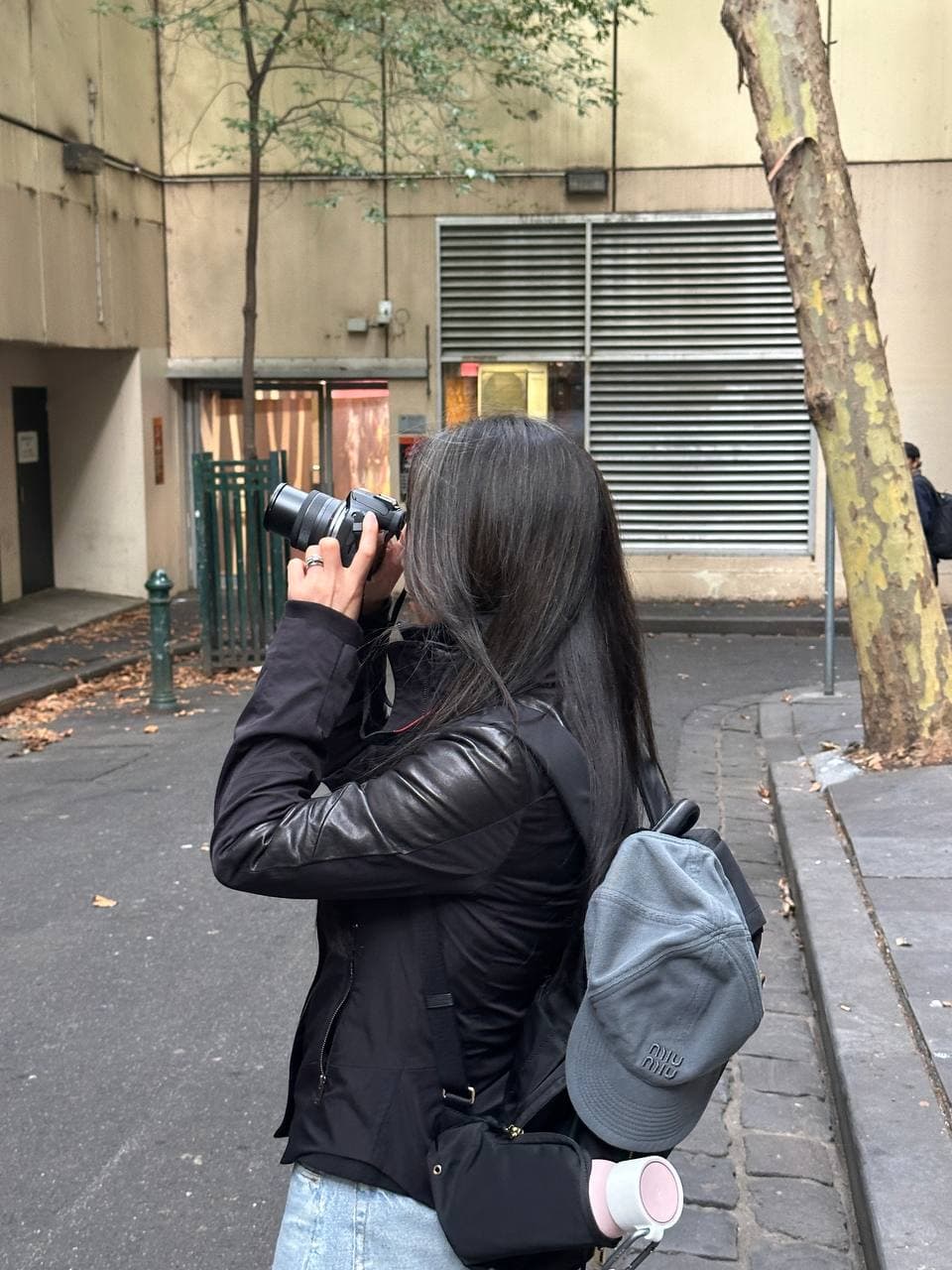 Janet shooting with her Canon R100 in Melbourne CBD during a photography course